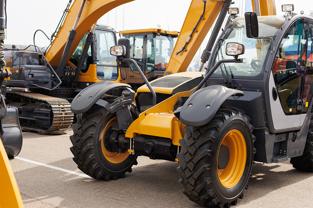 Construction equipment with enclosed glass cabs requiring specialty glass service